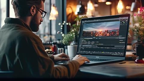 Student attending After Effects course working on computer while creating motion graphics.