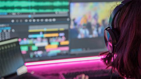 10 Best Premiere Pro Courses to take in 2025 Creative Cloud video editing course student working at a computer.