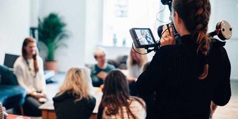 Students learning video editing and video production in a Premiere Pro course