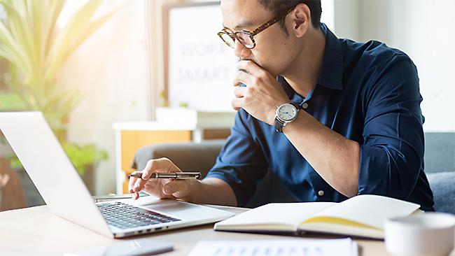 Student working at a computer attending a Power BI course online.