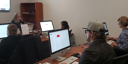 Instructor leading live InDesign course for beginners.