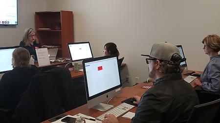 Instructor leading live InDesign course for beginners.